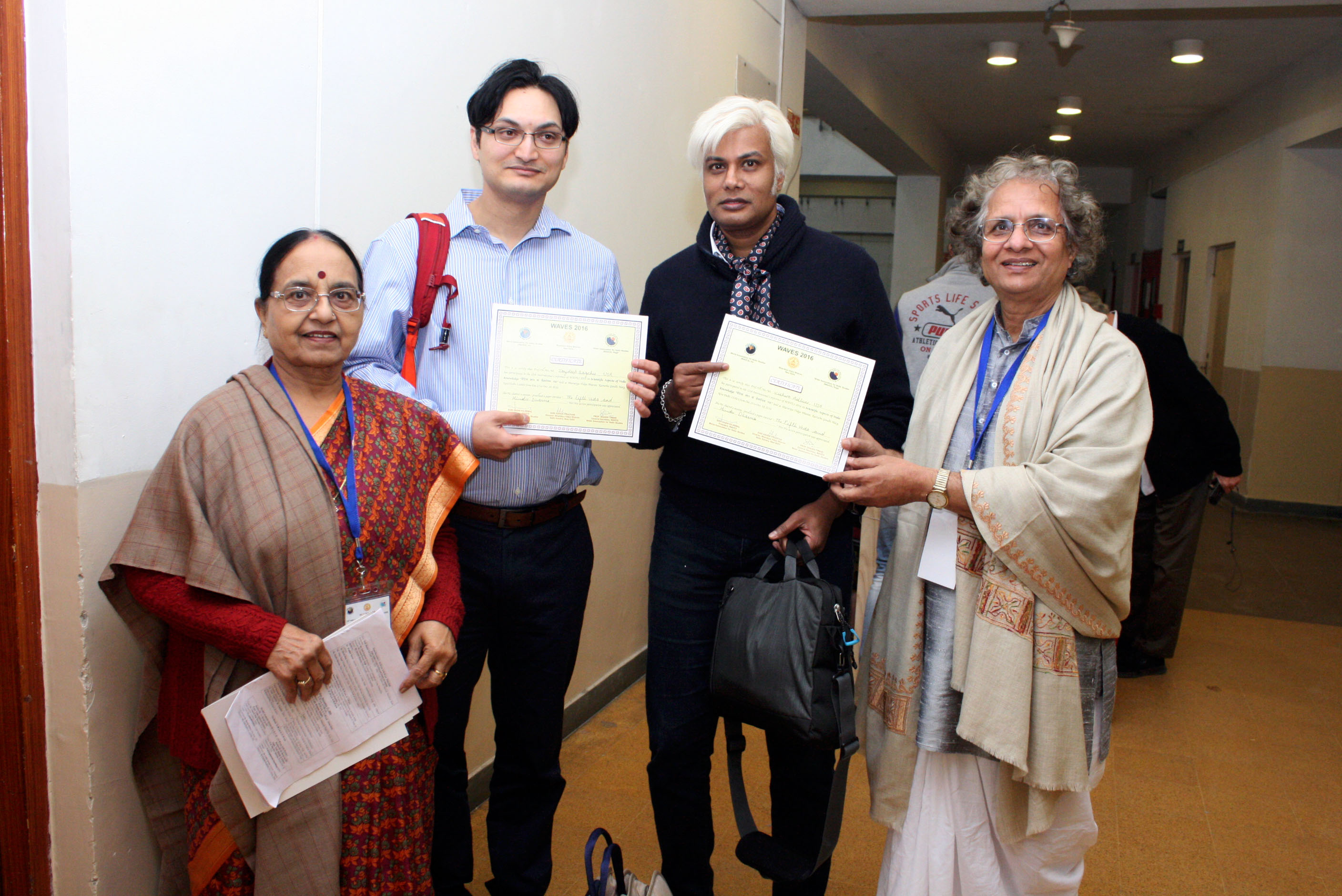 Prof. Singh along with Prof. Shashi Tiwari Presenting Certificates to Speakers of WAVES 2016